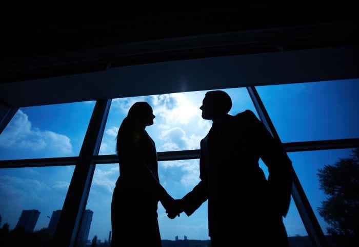 Man and woman shaking hands- national accounts